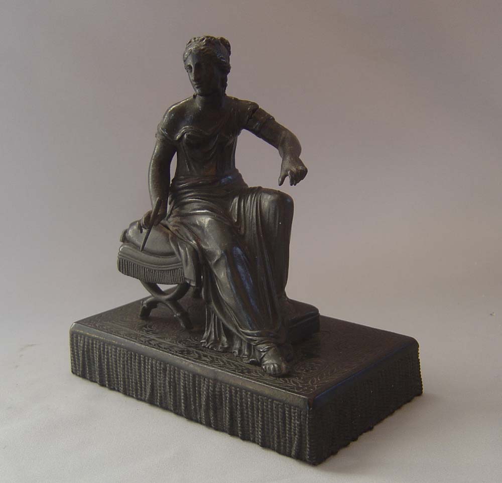 Antique Grand Tour bronze of woman on French Empire stool.