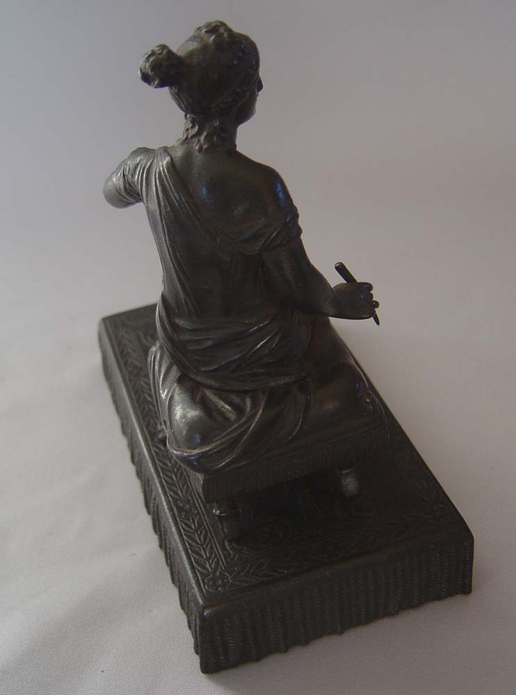 Antique Grand Tour bronze of woman on French Empire stool.