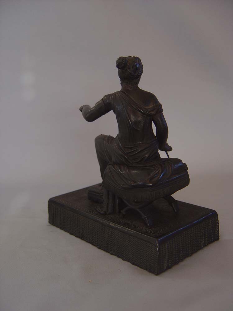 Antique Grand Tour bronze of woman on French Empire stool.