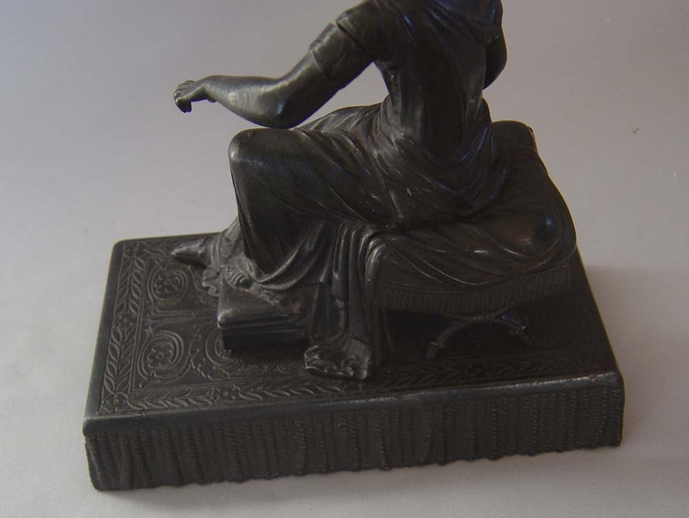 Antique Grand Tour bronze of woman on French Empire stool.