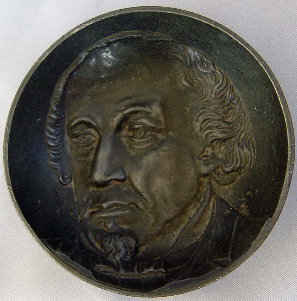 Antique sculpture of Disraeli in a Pewter dish.