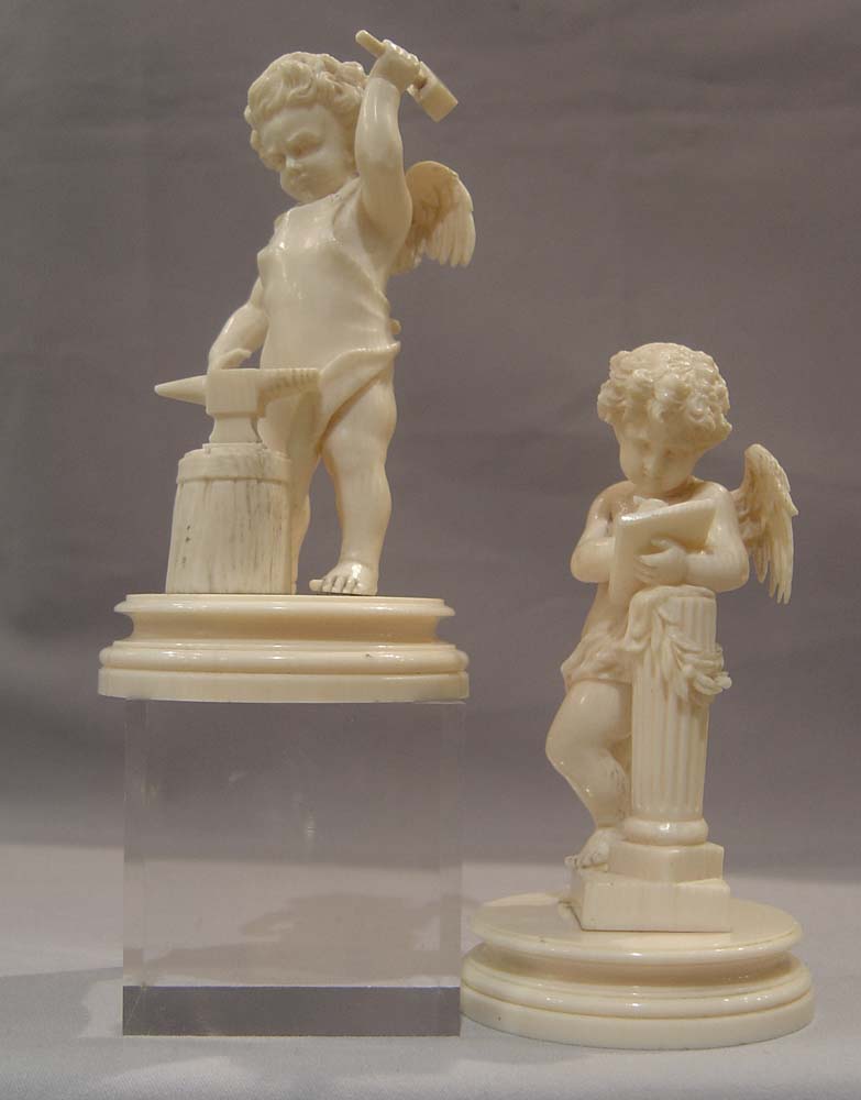 Ivory antique carved cupids, European,a pair, superbly carved