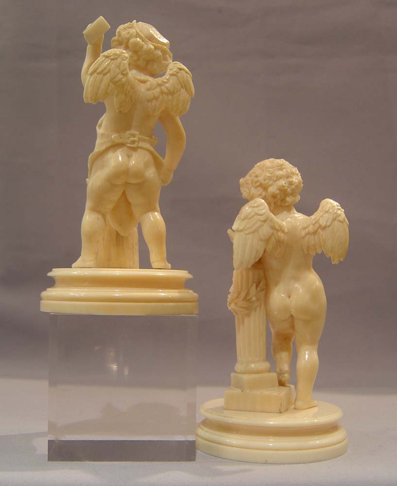 Ivory antique carved cupids, European,a pair, superbly carved