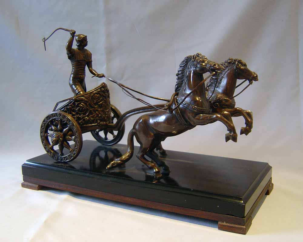 Antique Grand Tour bronze of charioteer on marble base.