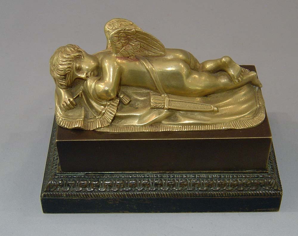 Antique French Empire inkwell with cupid asleep.