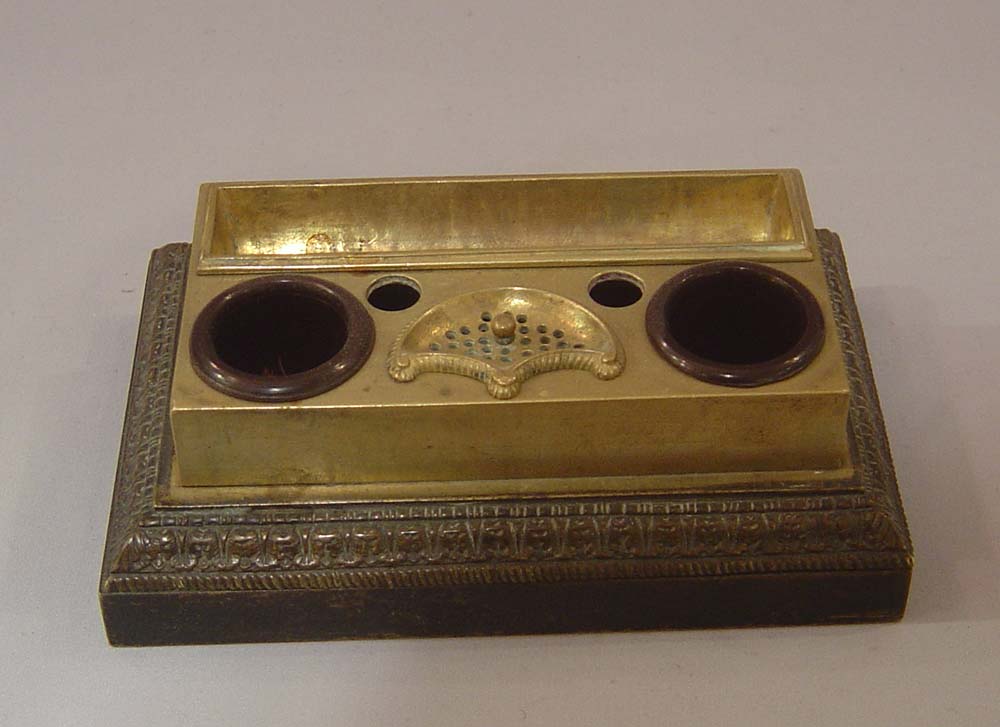 Antique French Empire inkwell with cupid asleep.