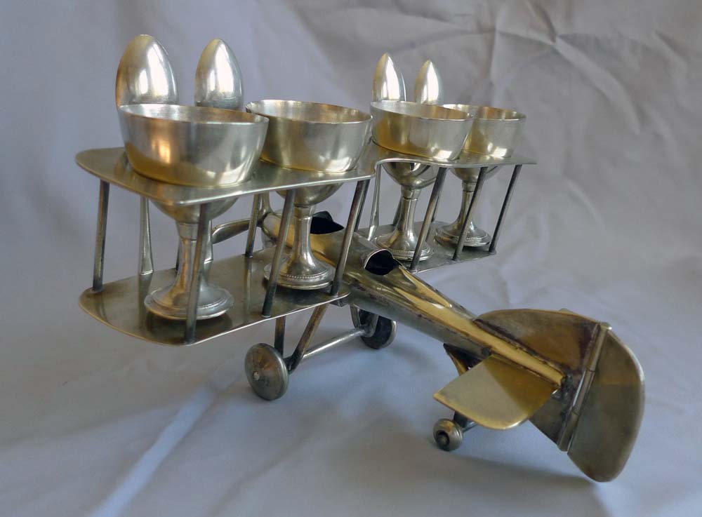 Unusual Art Deco bi-plane egg cup set.