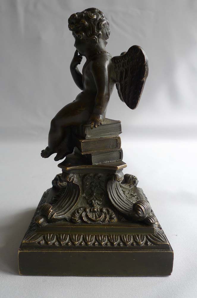 Antique English Regency bronze of winged cupid on fine base.