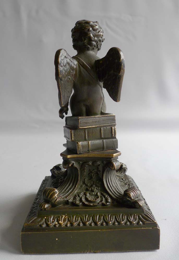 Antique English Regency bronze of winged cupid on fine base.