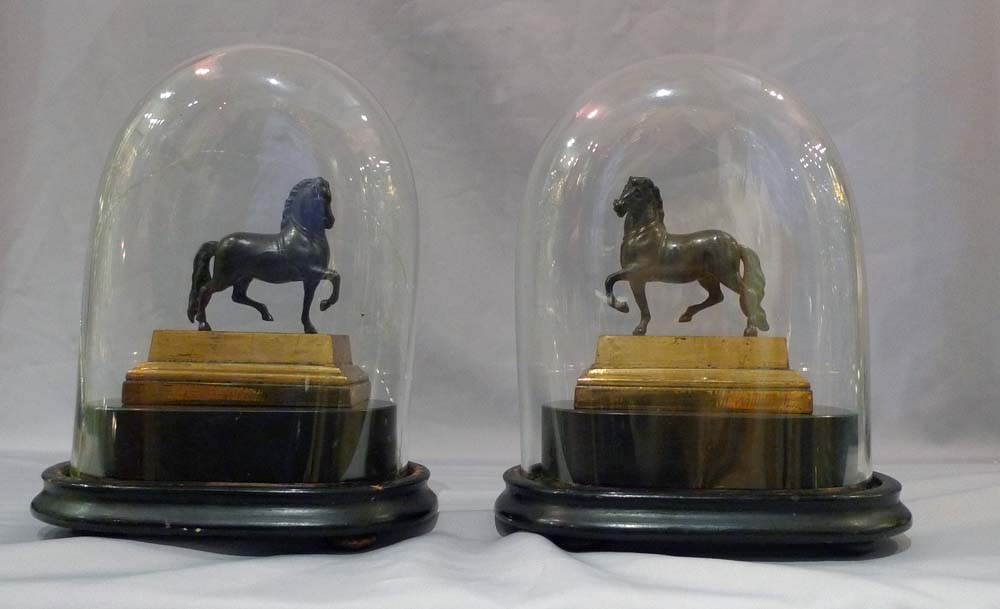 Pair English Geoge IV gilt lacquered models of classical horses, on bases and under domes.