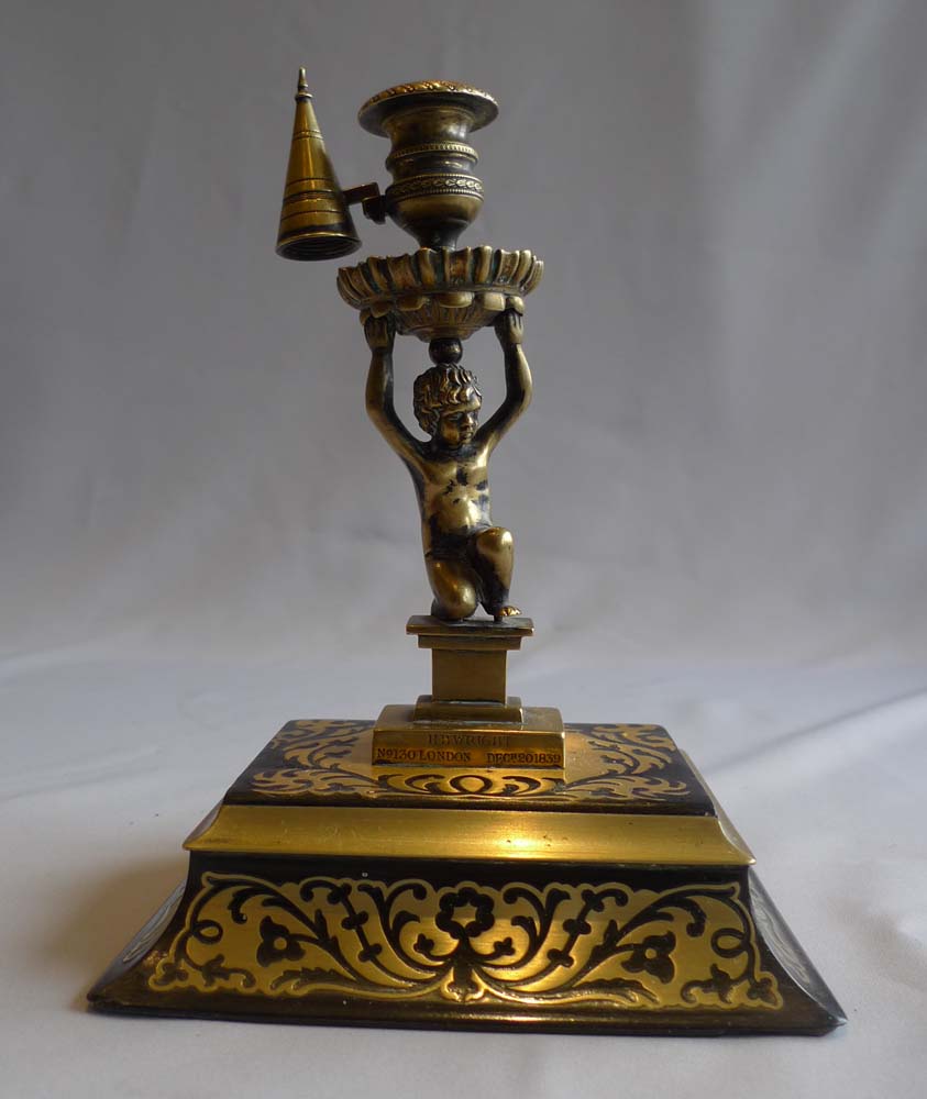 Antique English figural candlestick with snuffer on boulle base signed Wright and dated 1838.
