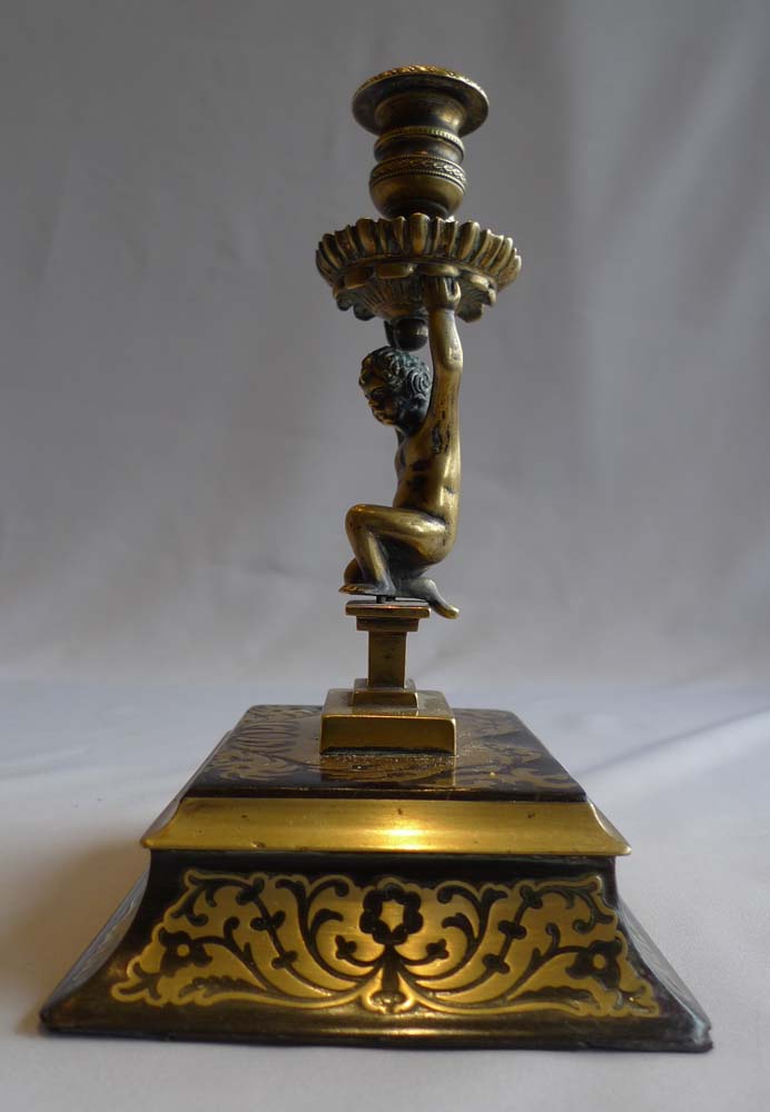Antique English figural candlestick with snuffer on boulle base signed Wright and dated 1838.