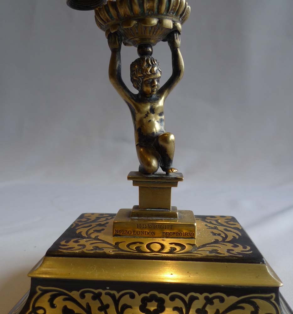 Antique English figural candlestick with snuffer on boulle base signed Wright and dated 1838.