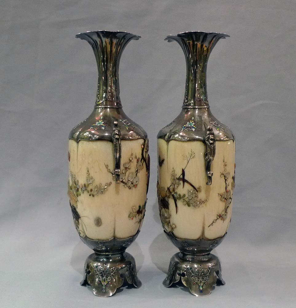 Japanese shibayama vases, a pair in ivory, silver, mother of pearl and semi precious stones.
