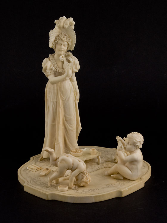 Ivory group of woman with two children, European.