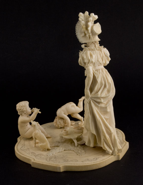 Ivory group of woman with two children, European.