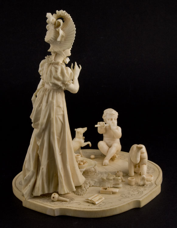 Ivory group of woman with two children, European.