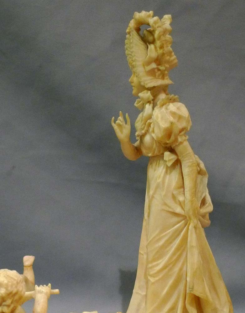 Ivory group of woman with two children, European.
