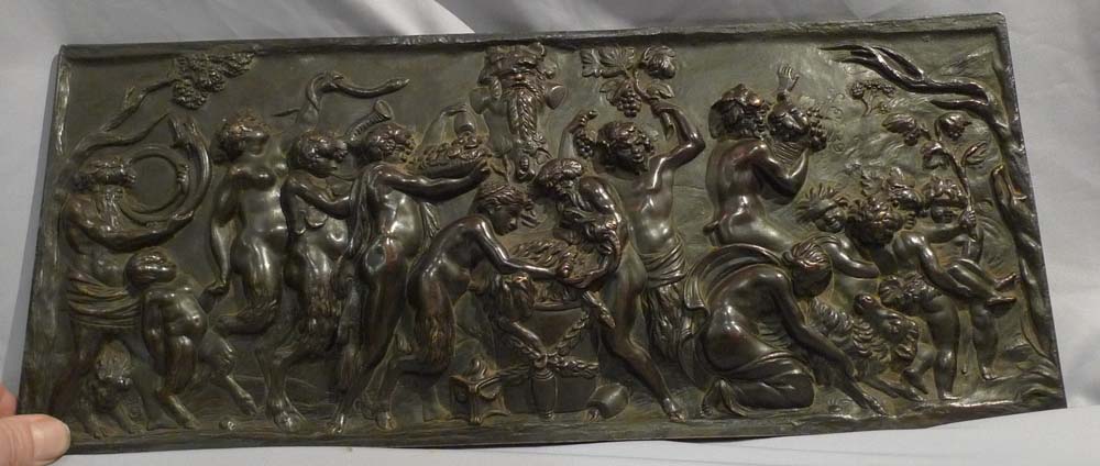 Antique bronze plaque of bacchanalian romp.