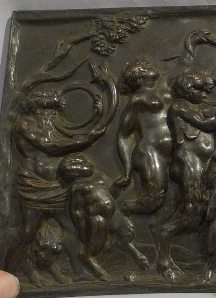 Antique bronze plaque of bacchanalian romp.