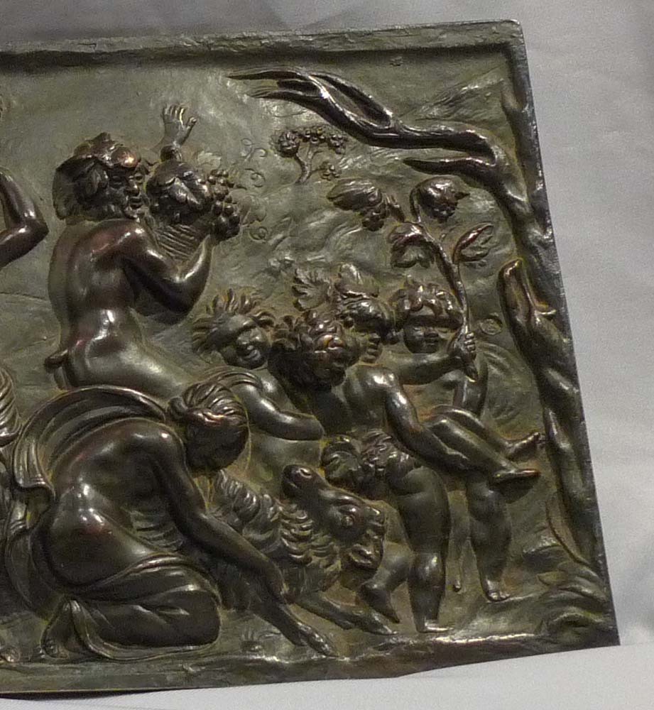 Antique bronze plaque of bacchanalian romp.