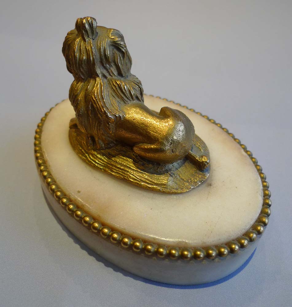 Louis XVIth antique French ormolu king Charles spaniel on oval carrera marble base.