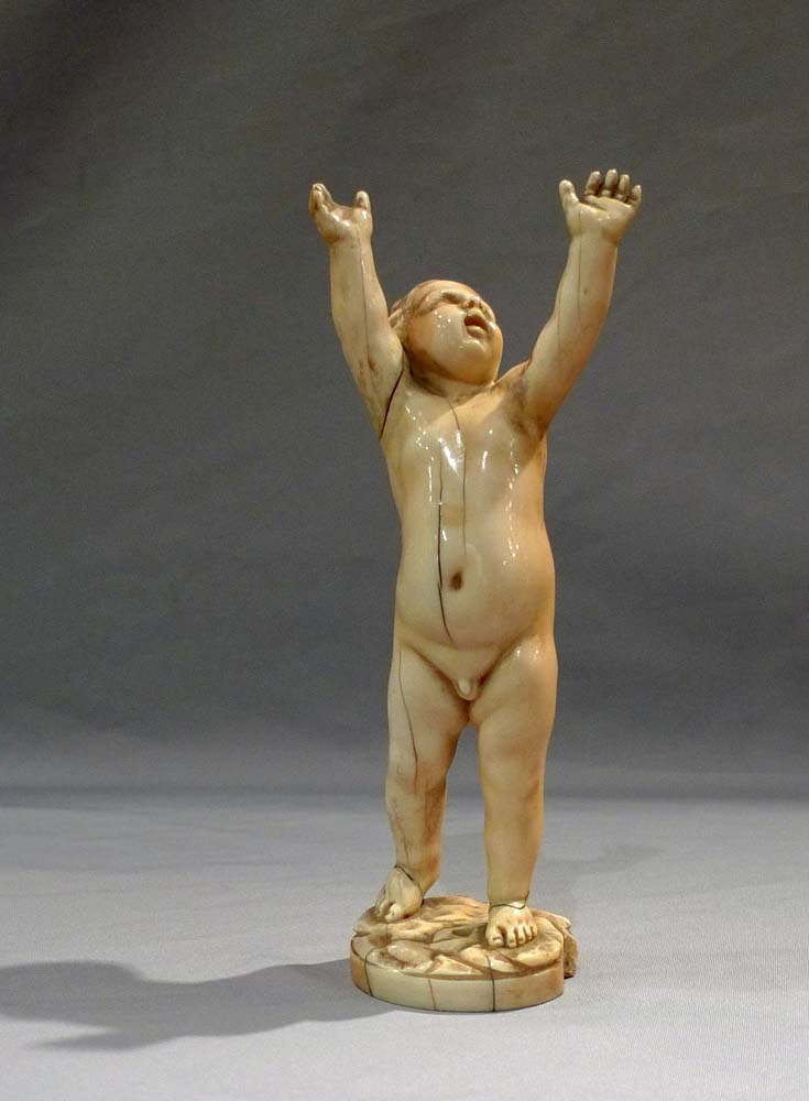 Antique ivory figure of a putto, European17th century.