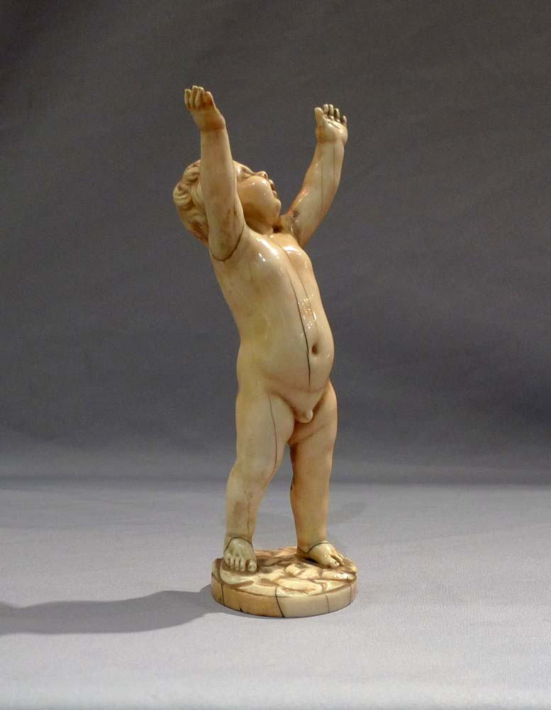 Antique ivory figure of a putto, European17th century.