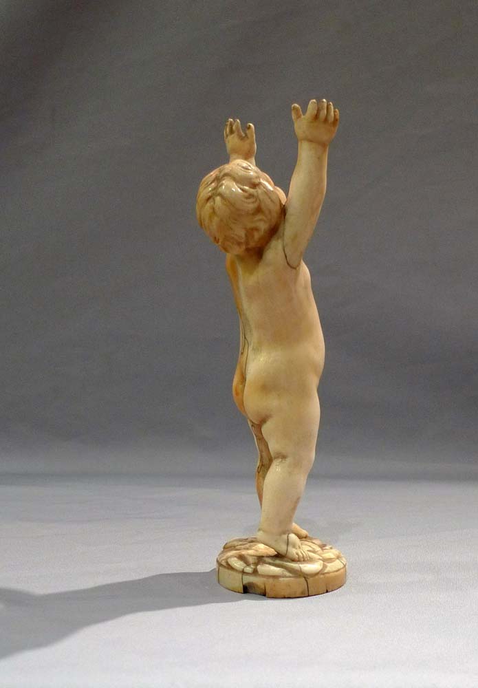 Antique ivory figure of a putto, European17th century.