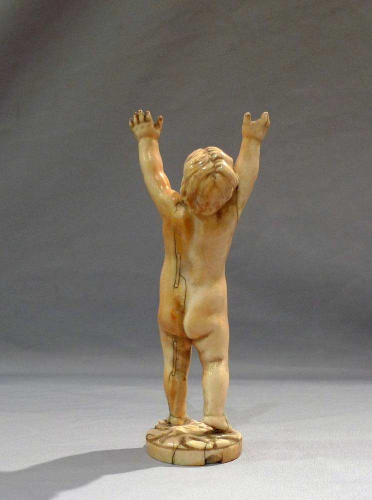 Antique ivory figure of a putto, European17th century.
