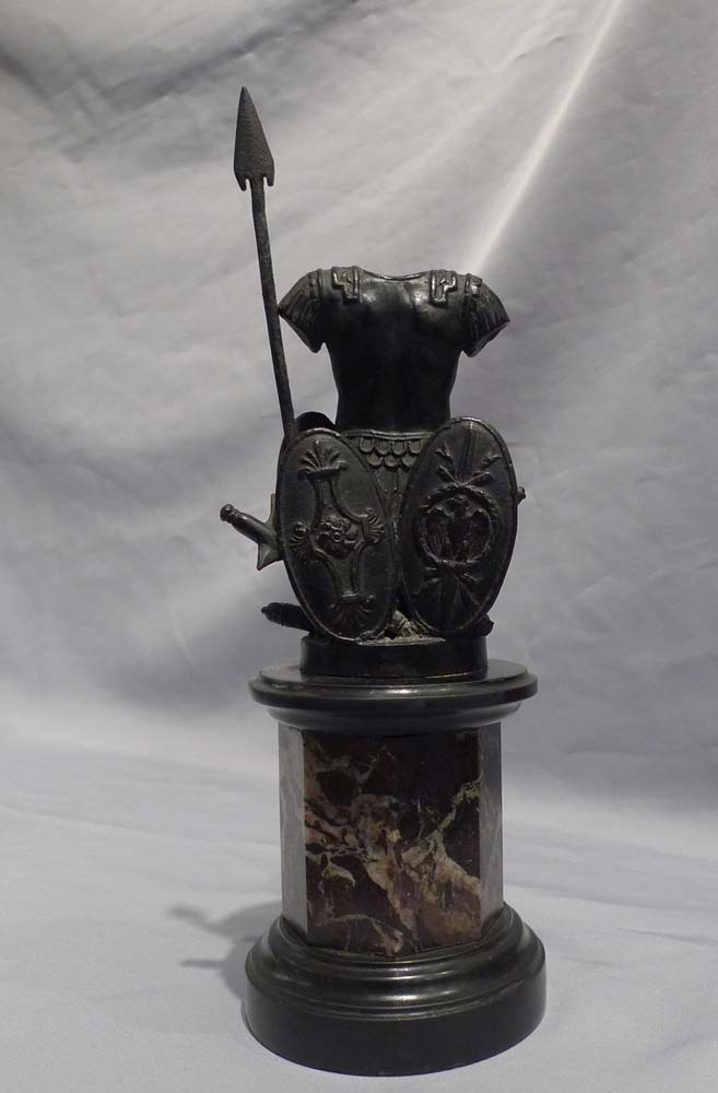 Pair antique grand tour bronze trophies of war on black marble and shaped variagated marble stems.