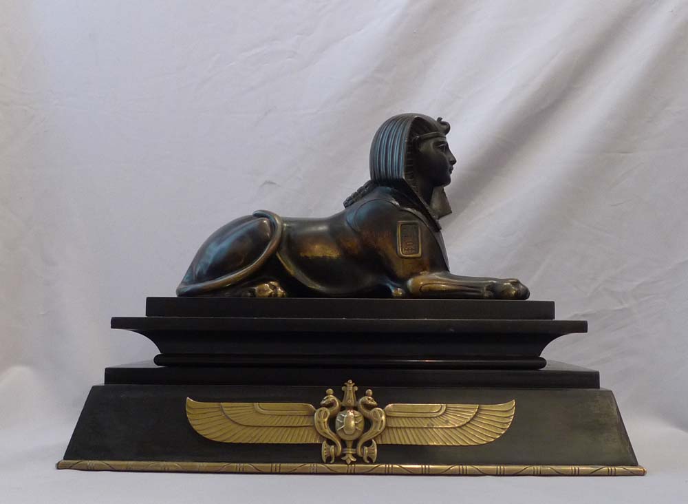 Antique Egyptian revival bronze of the Sphinx on bronze mounted black marble