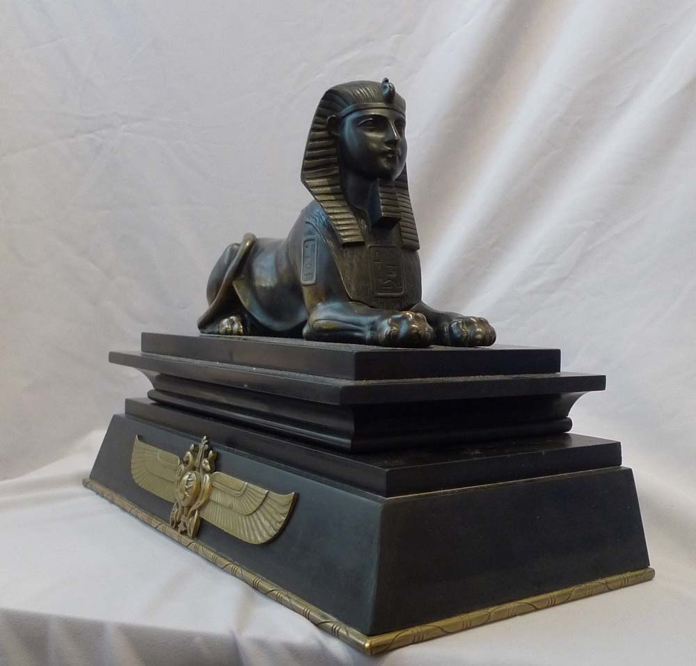 Antique Egyptian revival bronze of the Sphinx on bronze mounted black marble