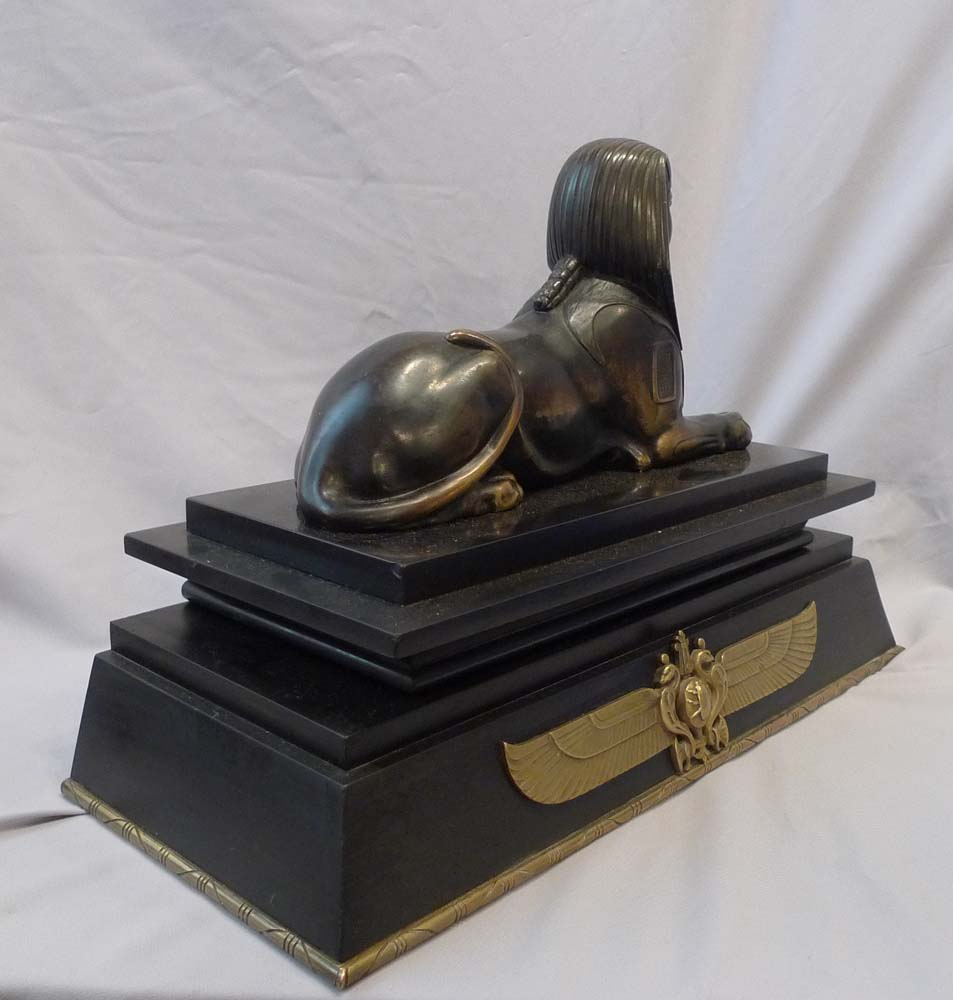 Antique Egyptian revival bronze of the Sphinx on bronze mounted black marble