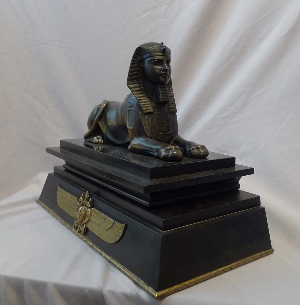 Antique Egyptian revival bronze of the Sphinx on bronze mounted black marble