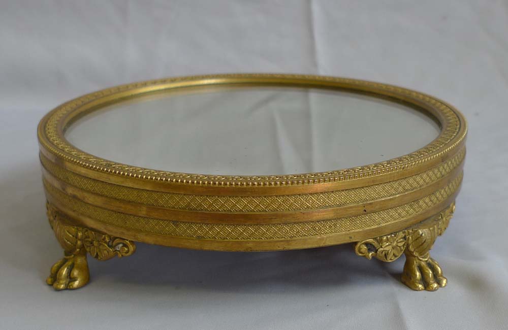 Antique mirrored and gilt bronze table stand in Empire style