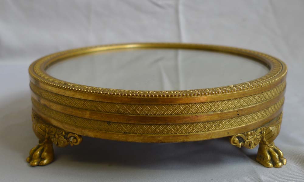 Antique mirrored and gilt bronze table stand in Empire style