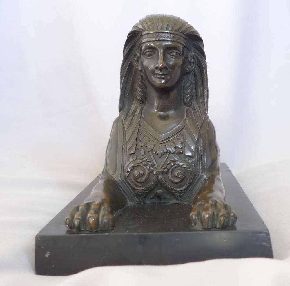 English Regency Egyptian revival sphinx on black marble base.