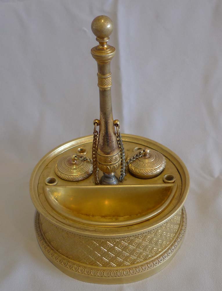 A French Empire ormolu inkwell.