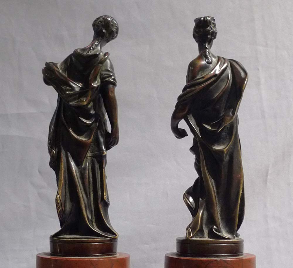 Pair Italian classical female bronzes on marble bases.
