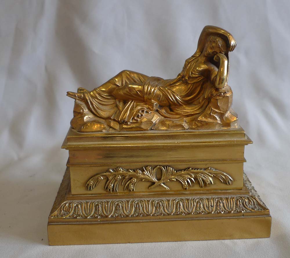 Antique French gilt bronze inkwell and sander with classical figure to the lid.