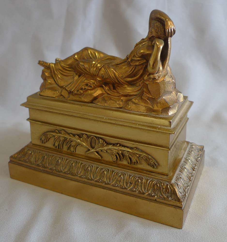 Antique French gilt bronze inkwell and sander with classical figure to the lid.