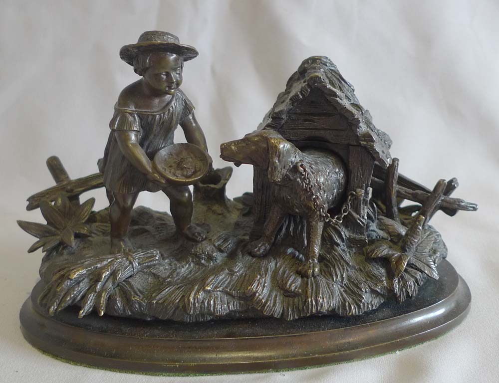 Antique French inkstand and pen holder with dog in kennel and boy.