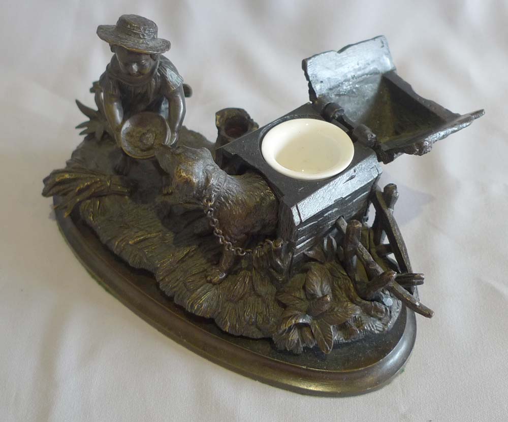 Antique French inkstand and pen holder with dog in kennel and boy.