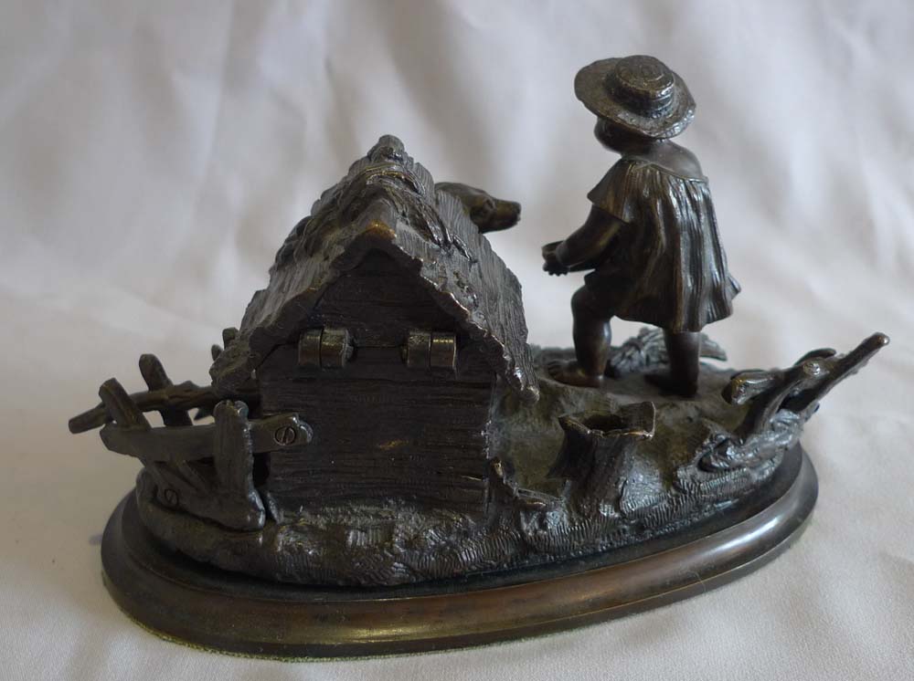 Antique French inkstand and pen holder with dog in kennel and boy.