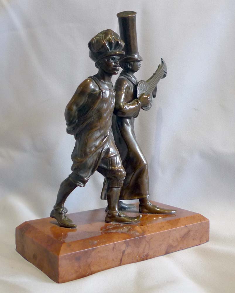 Austrian bronze of two men in New Orleans style dress on marble base.