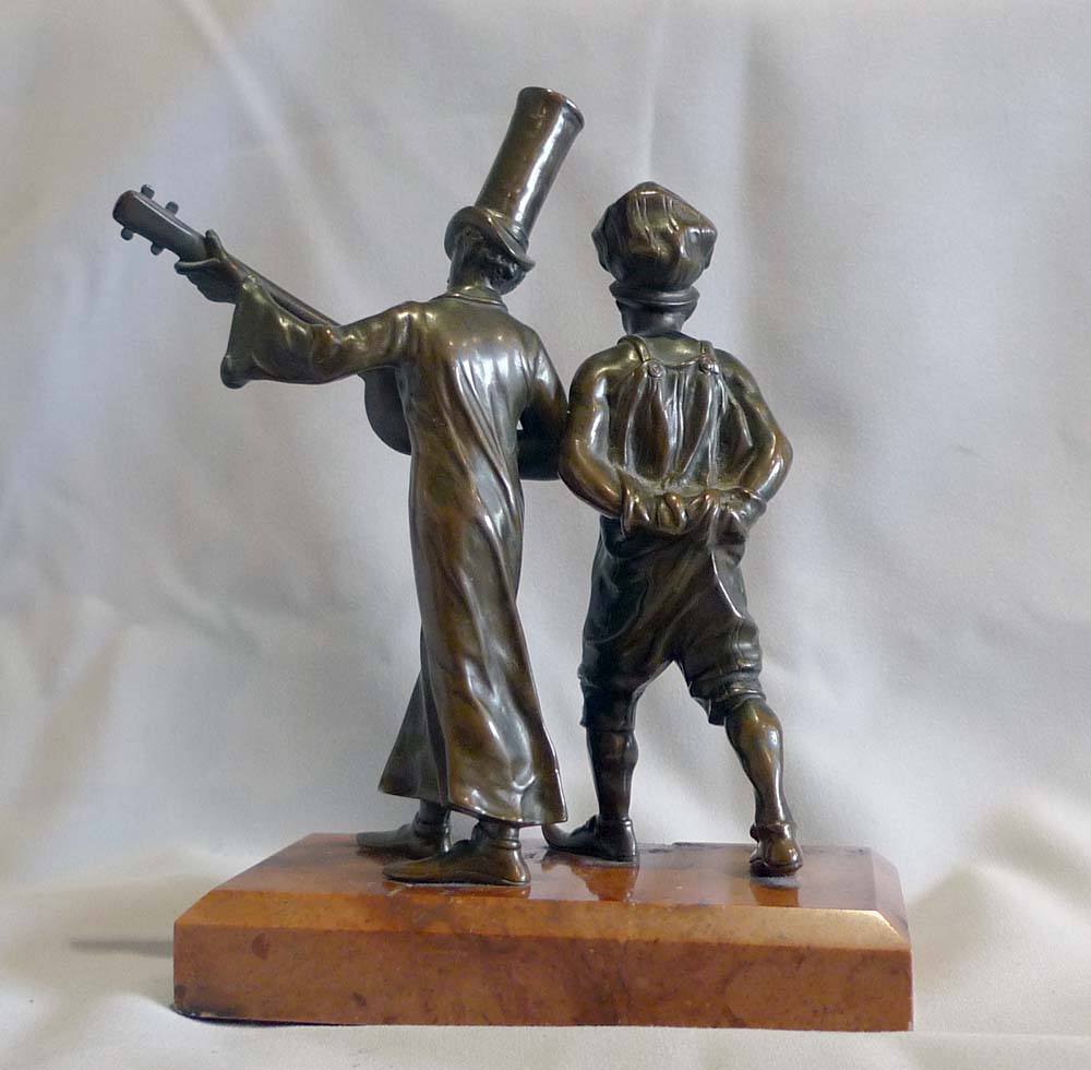 Austrian bronze of two men in New Orleans style dress on marble base.