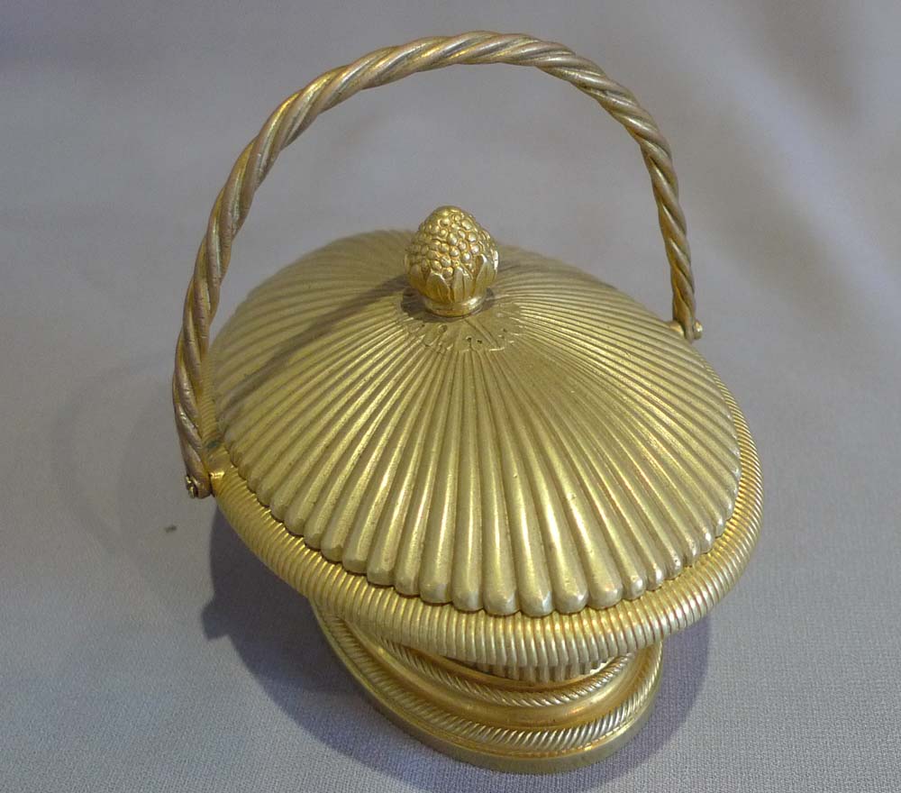 Antique ormolu inkwell modelled as a lidded basket.