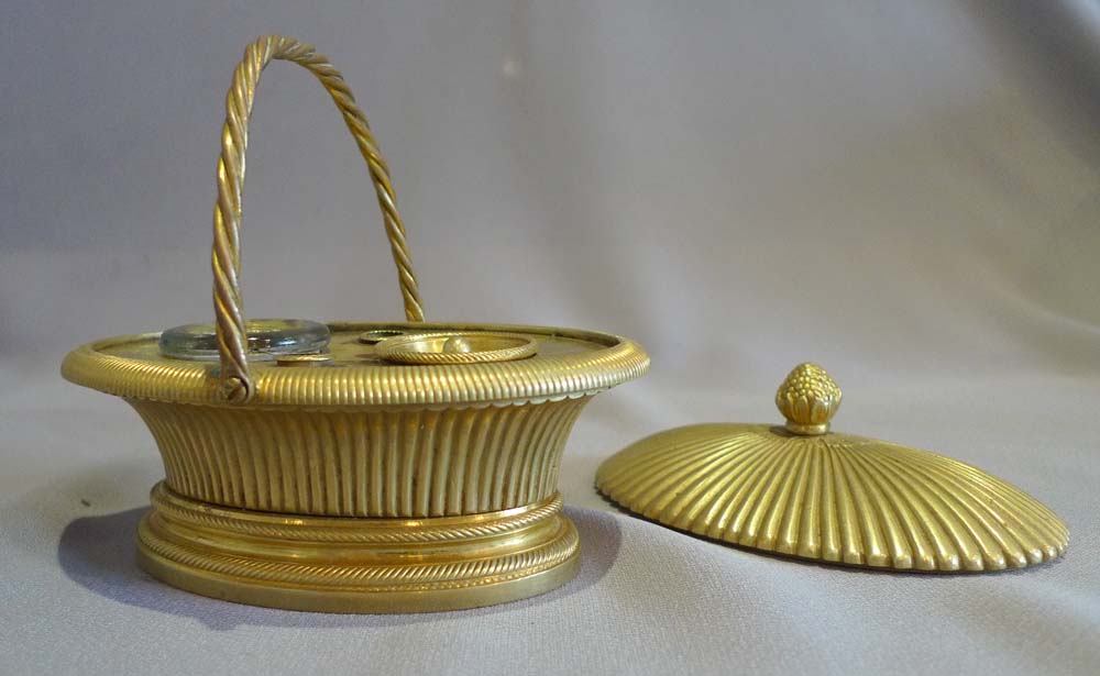 Antique ormolu inkwell modelled as a lidded basket.