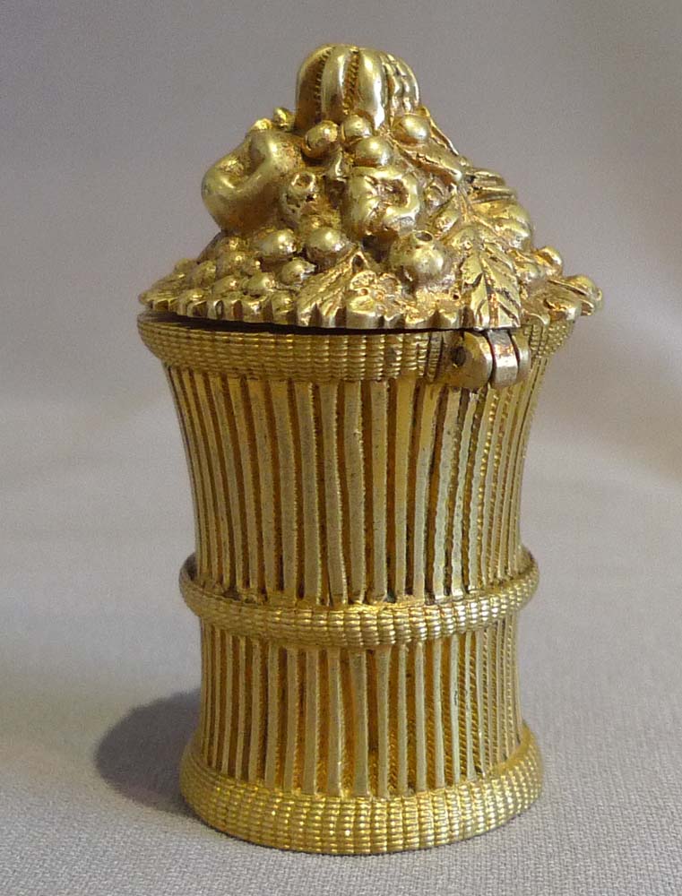Antique inkwell with hinged lid and modelled as a sheaf of corn.